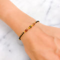 Radiant Polished 22k Gold Black Bead Bracelet