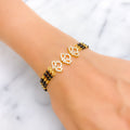 Sparkling Upscale 22k Gold Black Bead Bracelet