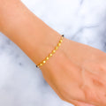 Stylish Brilliant 22k Gold Black Bead Bracelet