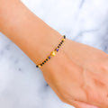 Tasteful Fine 22k Gold Black Bead Bracelet