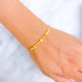 Captivating Striped Orb 22k Gold Bracelet