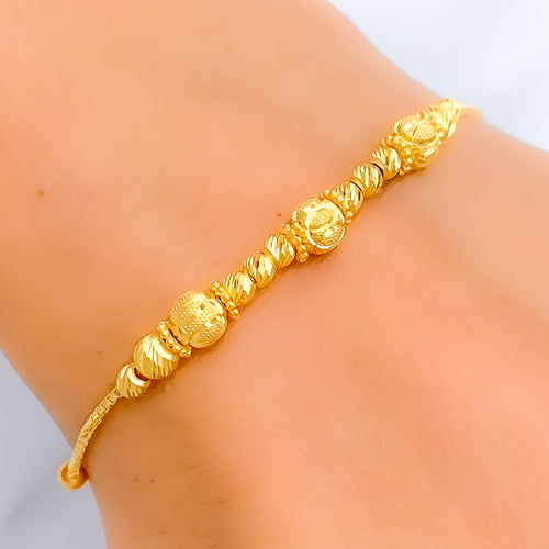 Captivating Striped Orb 22k Gold Bracelet