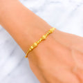 Captivating Striped Orb 22k Gold Bracelet