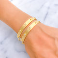 Iconic Contour 22k Gold CZ Bangle Pair 