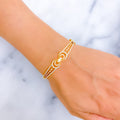 glistening-bow-shaped-diamond-18k-gold-bangle-bracelet