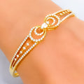 glistening-bow-shaped-diamond-18k-gold-bangle-bracelet