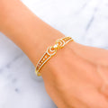 glistening-bow-shaped-diamond-18k-gold-bangle-bracelet