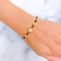 beautiful-orb-22k-gold-black-bead-bracelet