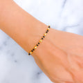 dainty-chic-22k-gold-black-bead-bracelet