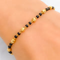 dainty-chic-22k-gold-black-bead-bracelet