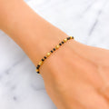 dainty-chic-22k-gold-black-bead-bracelet