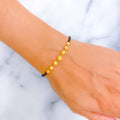 tasteful-exclusive-22k-gold-black-bead-bracelet