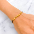 tasteful-exclusive-22k-gold-black-bead-bracelet