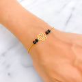 dazzling-flower-22k-gold-black-bead-bracelet