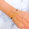 shimmering-graceful-22k-gold-black-bead-bracelet