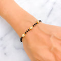 elegant-orb-22k-gold-black-bead-bracelet