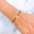 subtle-flower-22k-gold-black-bead-bracelet