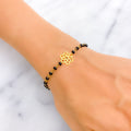 subtle-flower-22k-gold-black-bead-bracelet