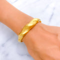 bold-flowing-21k-statement-bangle-bracelet