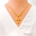 Fancy Flower Accented 22k Gold Cross Pendant 