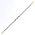 radiant-polished-22k-gold-black-bead-bracelet