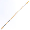 stylish-brilliant-22k-gold-black-bead-bracelet