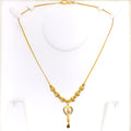 lavish-dangling-heart-21k-gold-necklace