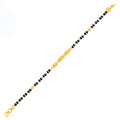 striking-petite-22k-gold-black-bead-baby-bracelet