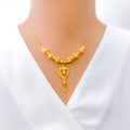 lavish-dangling-heart-21k-gold-necklace