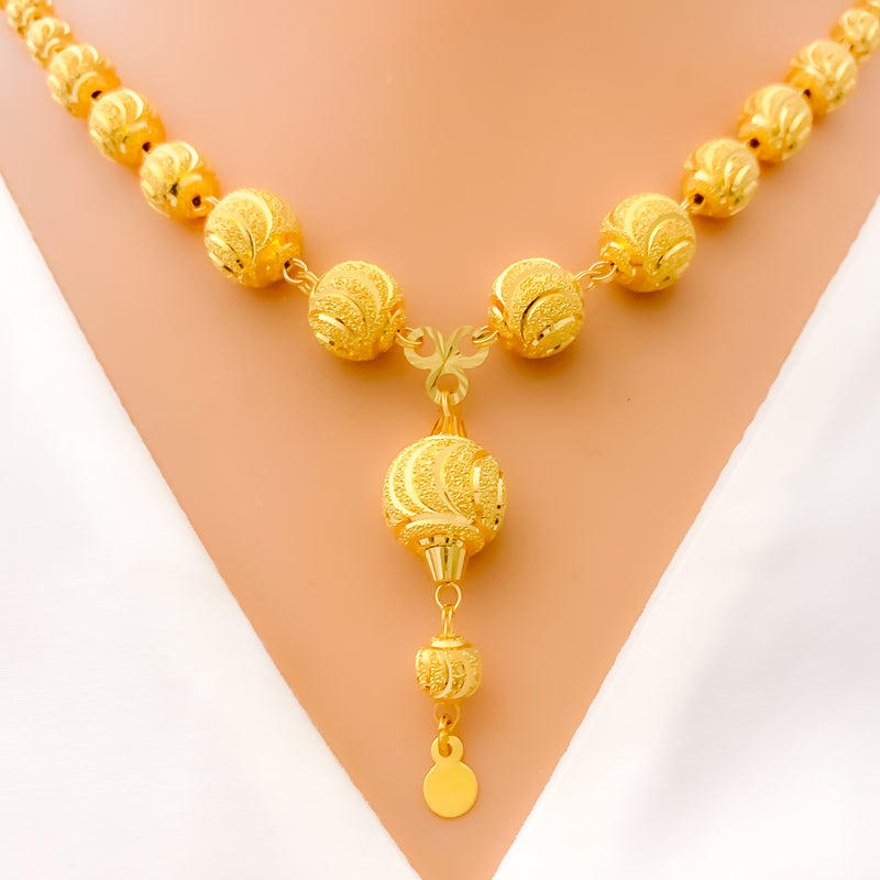 decadent-curved-orb-21k-gold-necklace