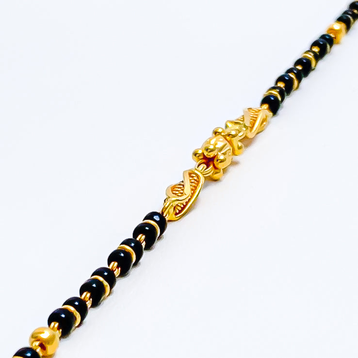 Gold black beads for baby Clearance