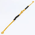 slender-noble-22k-gold-black-bead-baby-bracelet