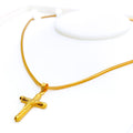 gleaming-22k-gold-cross-pendant