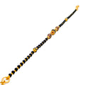 radiant-polished-22k-gold-black-bead-bracelet