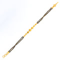 Reflective Striped 22k Gold Black Bead Bracelet 