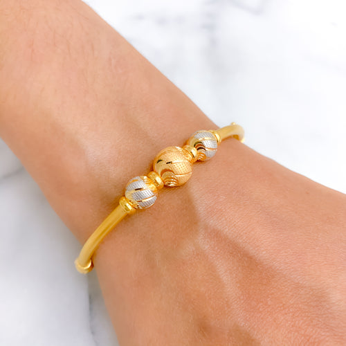 Ornate two-tone wave bangle bracelet