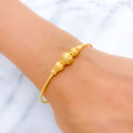 22k-gold-Upscale Shimmery Orb Bangle Bracelet