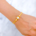 22k-gold-Bold Stately Striped Orb Bangle Bracelet