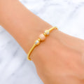 22k-gold-Charming Rose Gold Accented Orb Bangle Bracelet