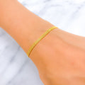 22k-gold-Modest Dual Tone Flat Bracelet