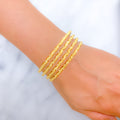 22k-gold-Reflective Wavy Textured Bangles