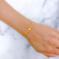 Reflective Oval 22k Gold Bead Bracelet