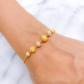 Fancy Striking Round 22k Gold Bracelet