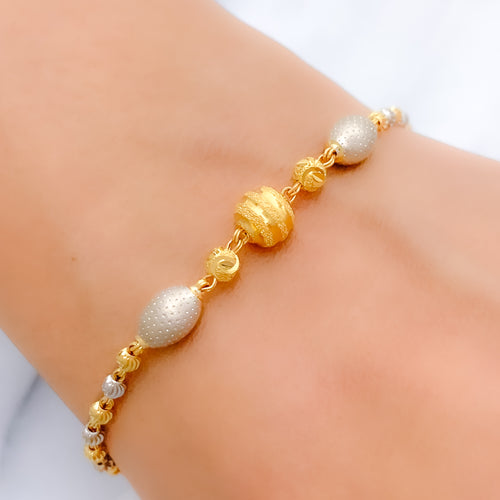 Trendy Contemporary Oval 22k Gold Orb Bracelet