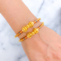 22k-gold-flower-adorned-vibrant-pipe-bangles