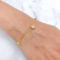 Three-Tone Gold Charm Bracelet