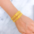 22k-gold-graceful-flower-accented-striped-bangles