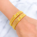22k-gold-graceful-flower-accented-striped-bangles
