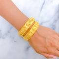 21k-gold-Jazzy Looped Screw Bangles 