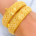 21k-gold-Jazzy Looped Screw Bangles 